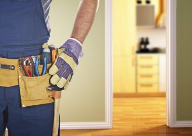 detail of classic leather tool belt wearing by handyman isolated